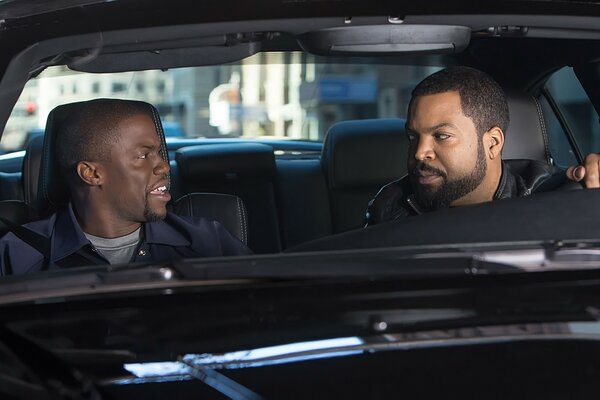 Two African Americans in a car