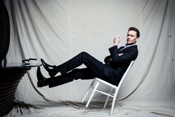 Male model posing on a chair