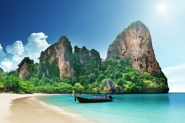 Boat on the background of the ocean and a tropical island