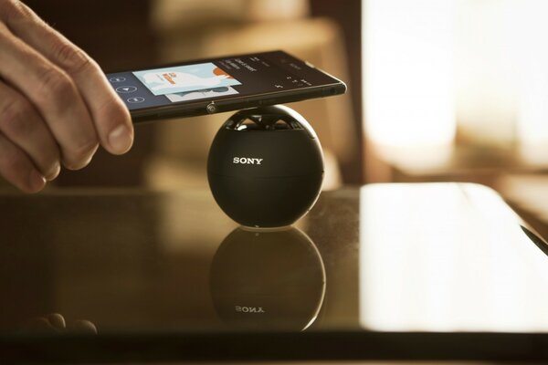 Sony wireless black speaker on the table