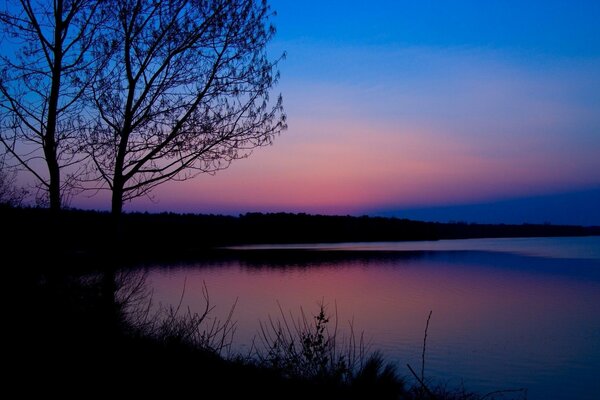 Late evening by the river. Pink sunset