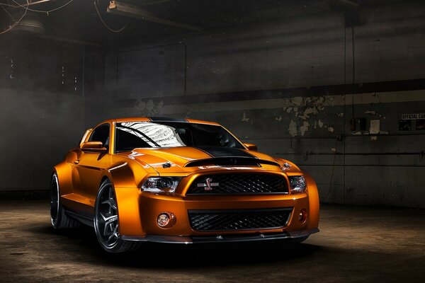 A car in a hangar. Brightness on a gray background