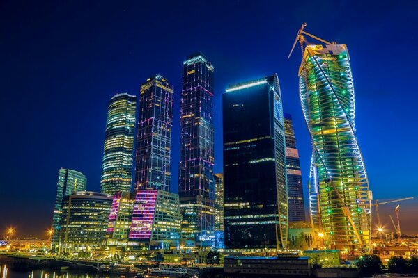 Many skyscrapers stand majestically in the night