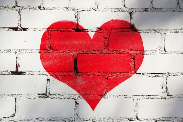 Painted heart on white bricks