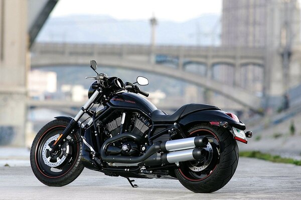 Motorcycle on the background of a blurred bridge