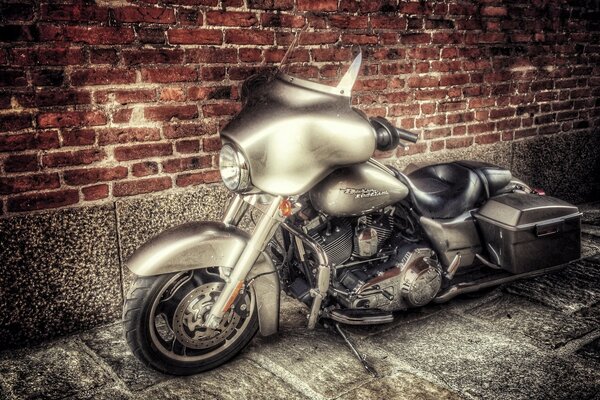 Harley Davidson. Vintage shot on the background of a brick wall