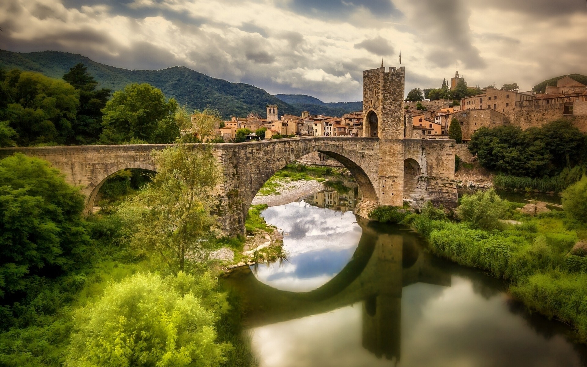 spain architecture travel bridge castle river water gothic ancient old landscape sky outdoors building city tree stone tower besalu bridge catalonia