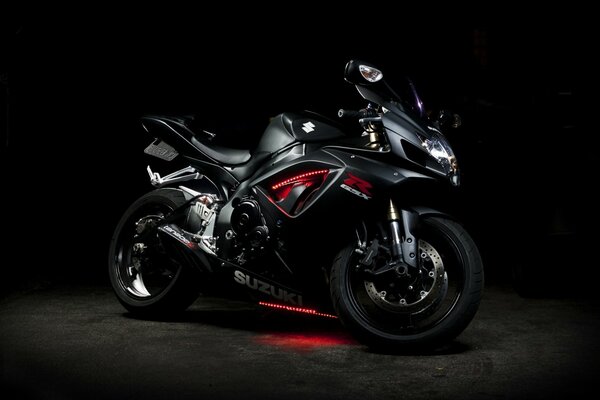 Modern motorcycle on a black background