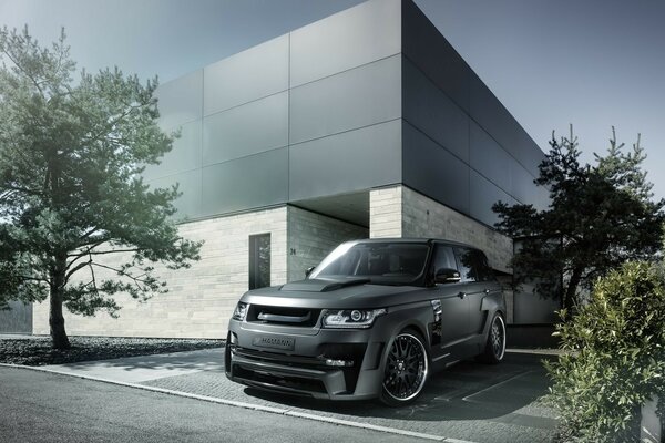 Range rover at a modern building