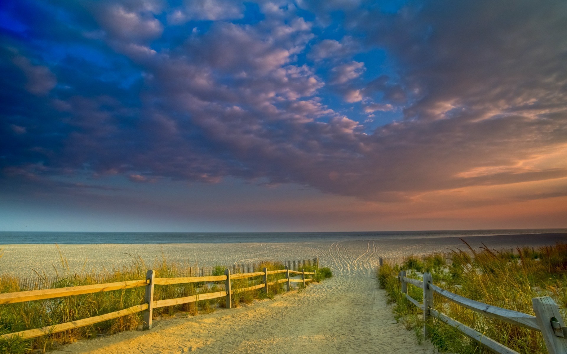 paesaggio cielo paesaggio natura all aperto tramonto erba acqua recinzione viaggi estate spiaggia mare luce del giorno sole campagna sabbia