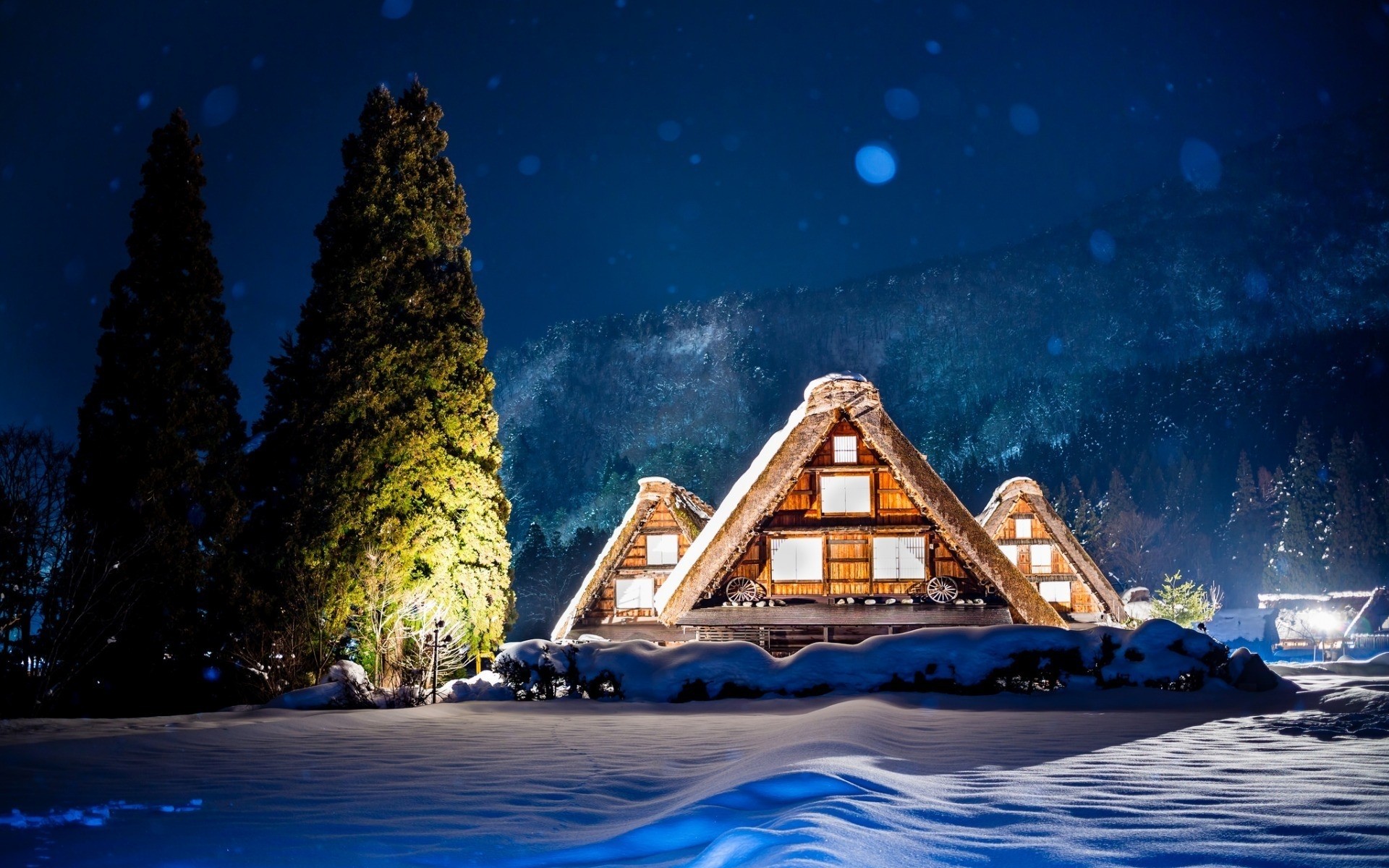 winter water travel sky house ocean sea outdoors vacation architecture building moon tree snow lights mountains forest cottage