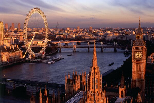 Ferris wheel on the river bank