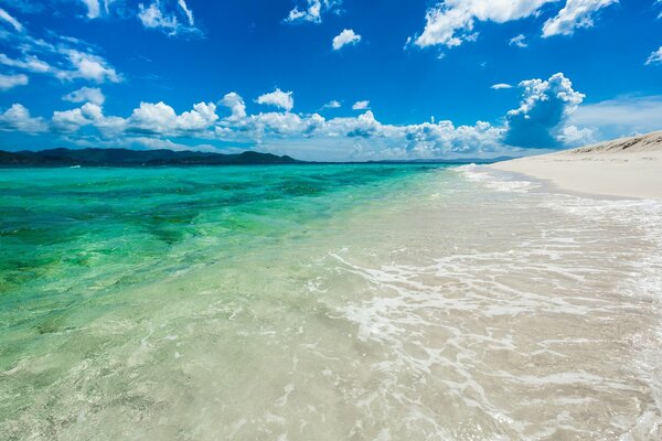 Gentle surf and turquoise sea