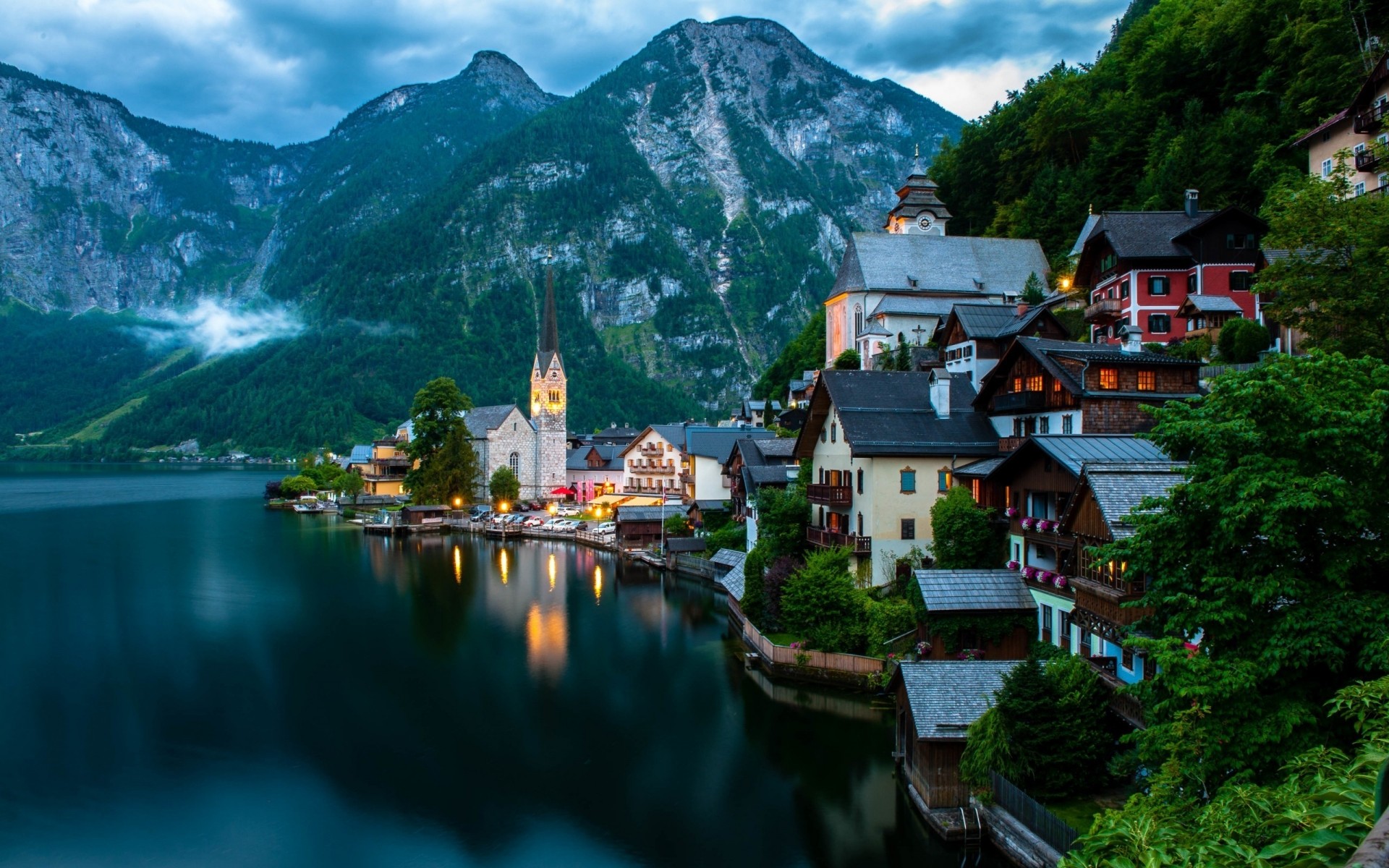 otras ciudades viajes agua lago al aire libre arquitectura casa montañas paisaje naturaleza ciudad fiordo río árbol cielo reflexión hallstatt austria montañas