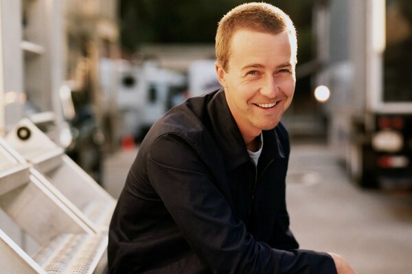 Smiling male actor with short hair