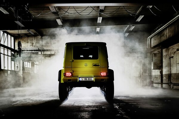 Car yellow view from the rear in the garage