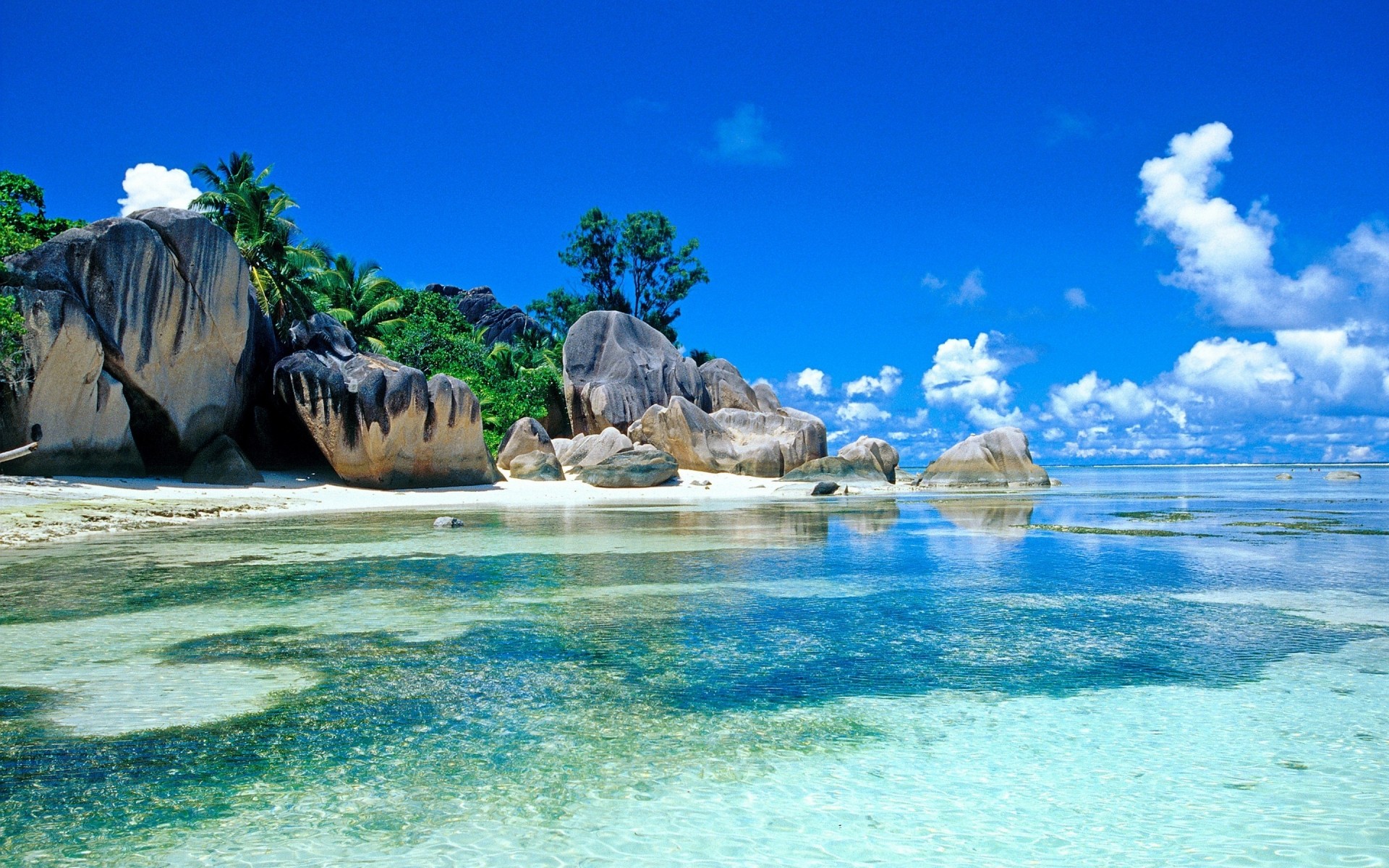 paisaje agua océano playa viajes mar mar tropical verano naturaleza cielo vacaciones paisaje isla paraíso arena hermosa turquesa ola bahía paisaje trópicos piedras palmeras nubes