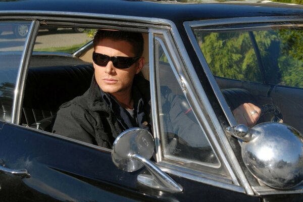 The Supernatural TV series. actor with glasses in the car