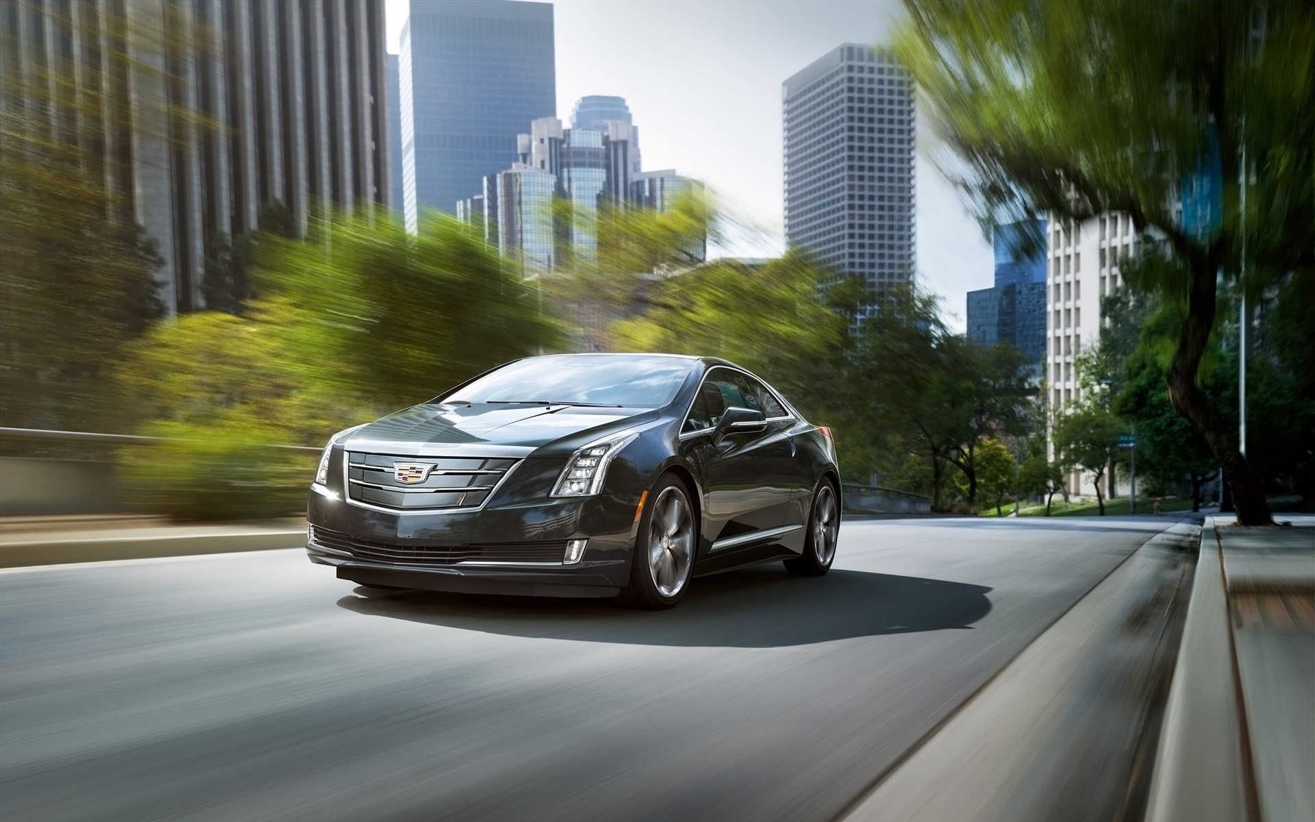 cadillac car road vehicle blur transportation system pavement asphalt street fast hurry city traffic drive action urban travel