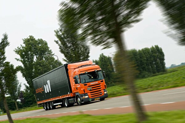 The orange cab of the truck is working