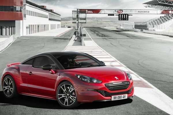 Red Peugeot car on the highway