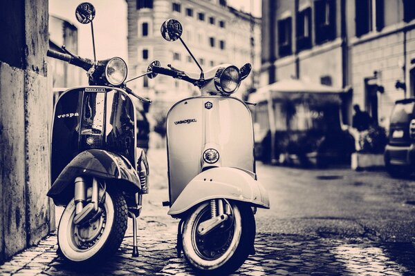 A couple of rare motorcycles in the city