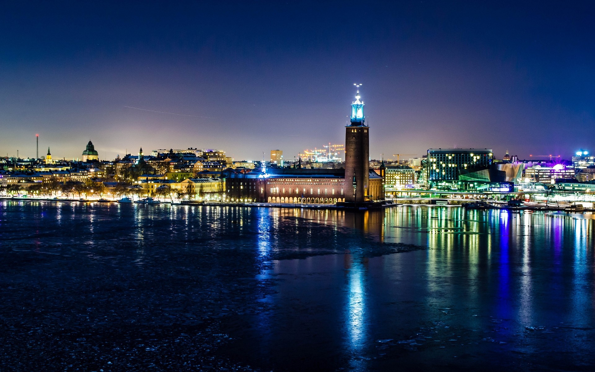 inne miasta woda miasto architektura zachód słońca zmierzch podróże miasto wieczorem skyline most odbicie niebo rzeka dom centrum miasta miejski promenada molo port sztokholm szwecja noc światła