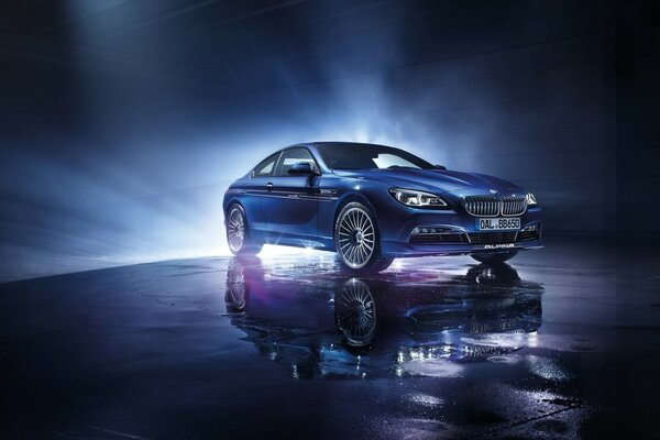 Blue BMW car in the spotlight