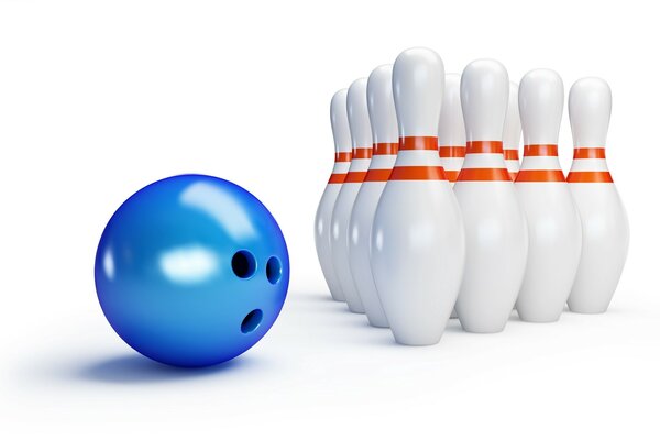 Bowling ball and bowling pins on a dark background