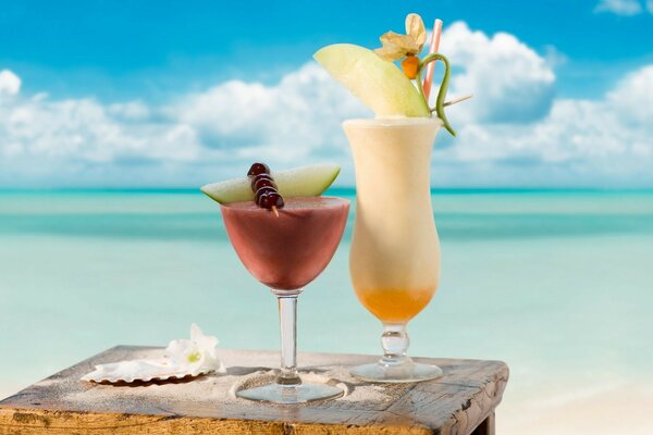 Tropical cocktail on the background of the sea and the sun