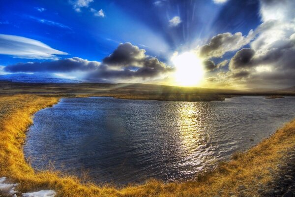 Landscape with sunset reflection on the lake