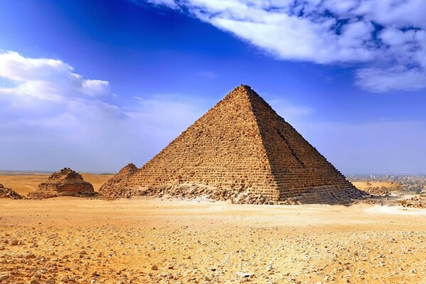 Egyptian pyramid on a blue sky background