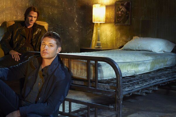 Sam and Dean in a hotel room