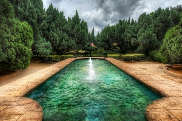 Beautiful fountain in the middle of a green park