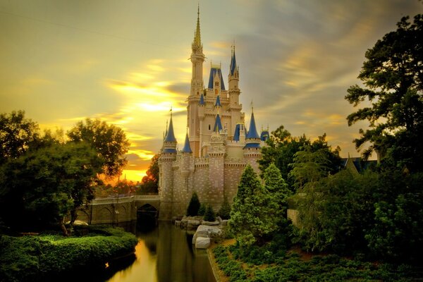 Castle at sunset on the river bank