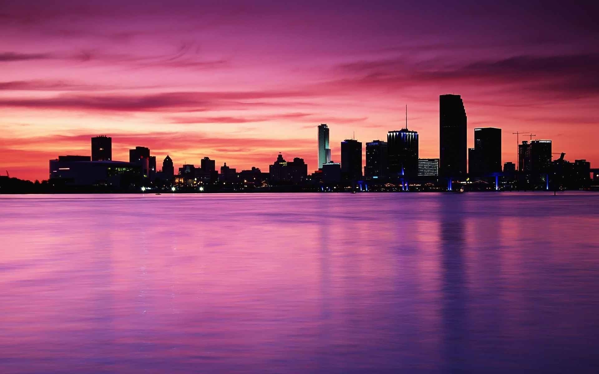 city dusk sunset downtown skyline architecture skyscraper cityscape water evening sky dawn reflection travel waterfront building river harbor pier