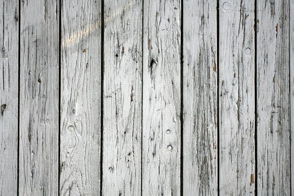 A simple wooden fence in black and gray