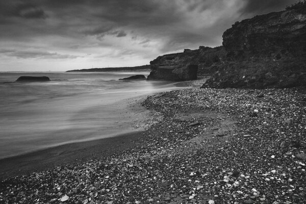 Beach with pebbles and bad weather