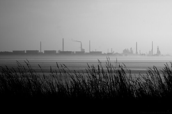 View of the factory pipes across the field