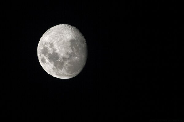 Gray moon on a black background