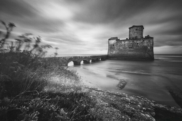 The road to the lighthouse. Black and white landscape