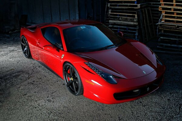 Red sports car on the sidewalk