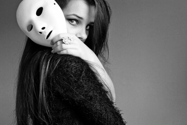 Black and white portrait of a girl with a mask