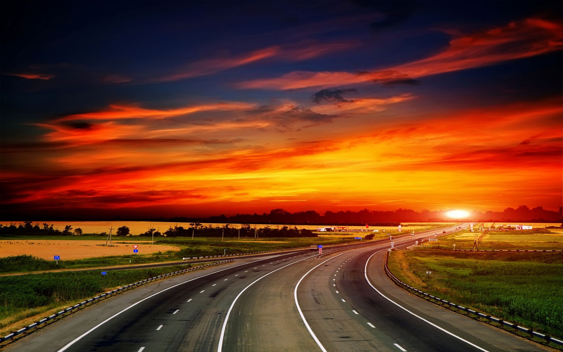 the sunset and sunrise road highway fast traffic transportation system asphalt car expressway long drive blur street guidance dramatic hurry motion travel perspective dusk