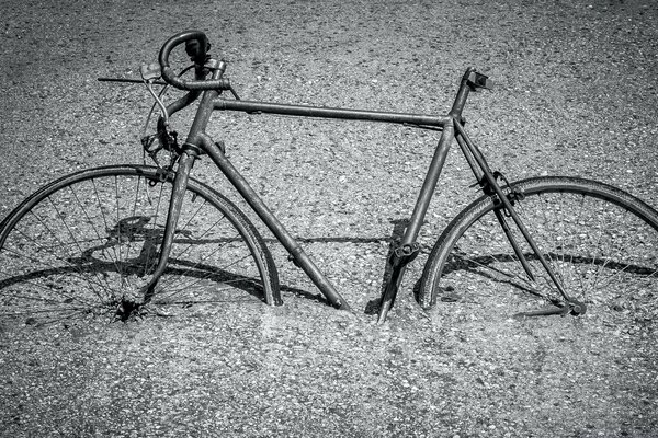 Retro bike covered with sand on the beach