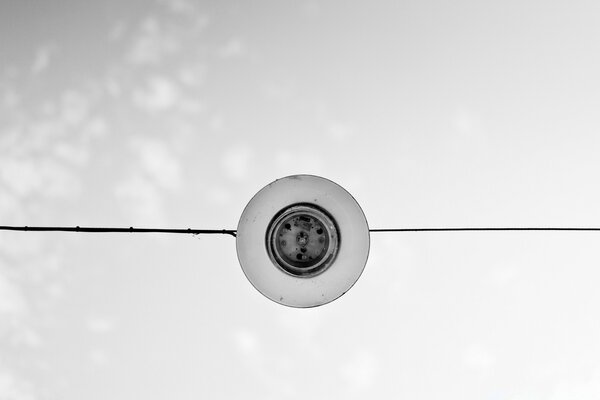 Circle on a wire against the sky