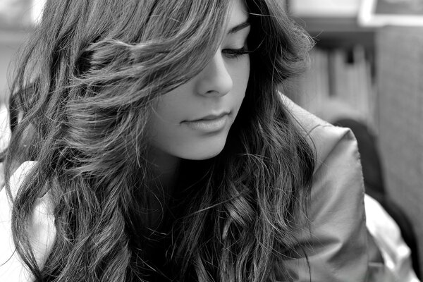 A woman with curly long hair