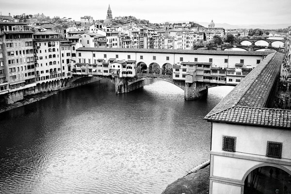 Black and white low-rise town on the river