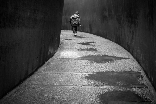 A child without adults walks down the street