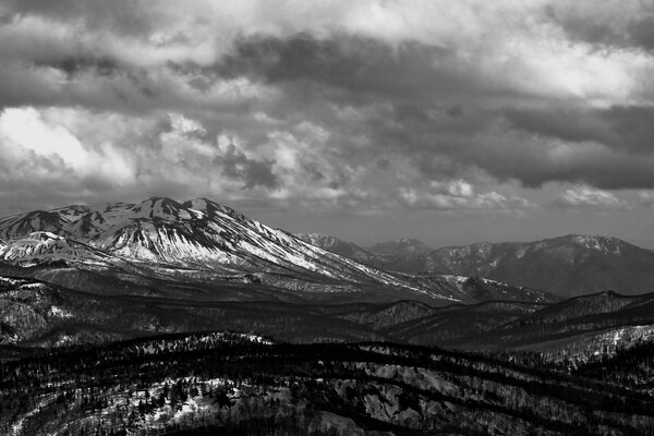 Black and white photo of snowy mountains
